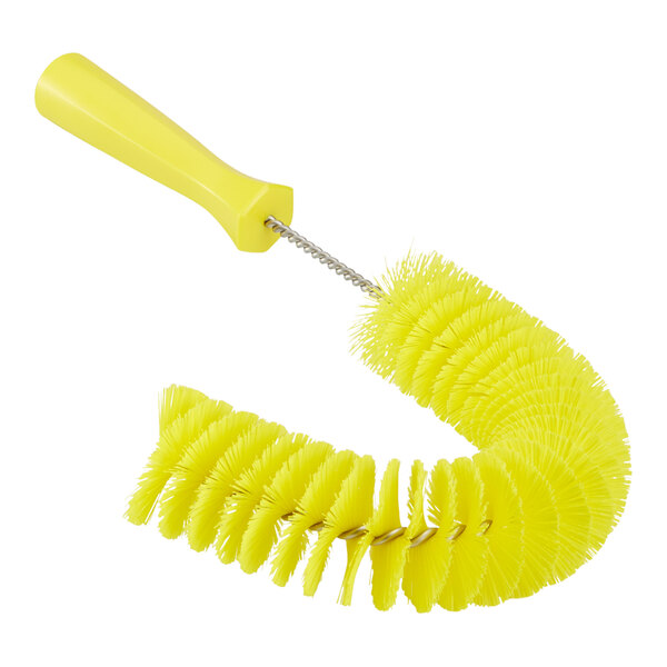 A yellow Vikan pipe brush with a handle.