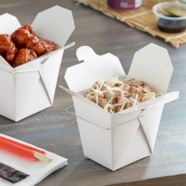 Two Emperor's Select white paper take-out containers with food inside.