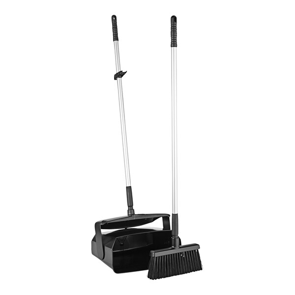 A black Remco lobby broom and dustpan with long handles.