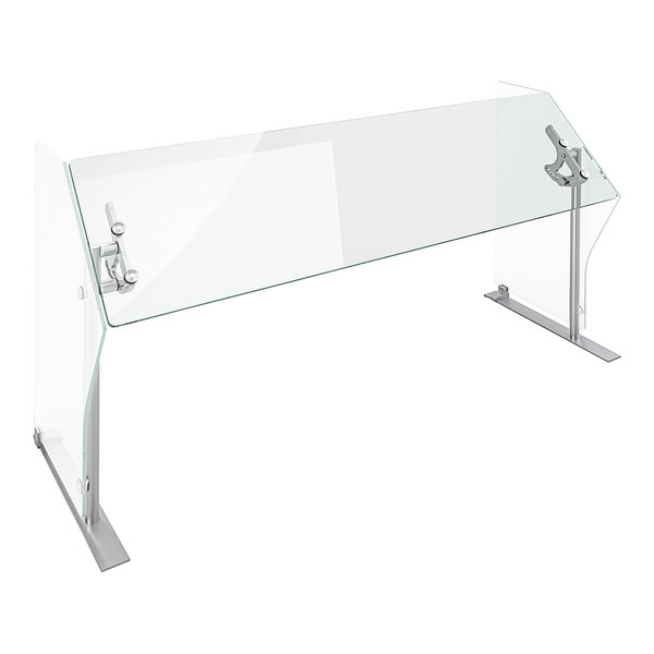 A clear glass rectangular sneeze guard with metal stands.