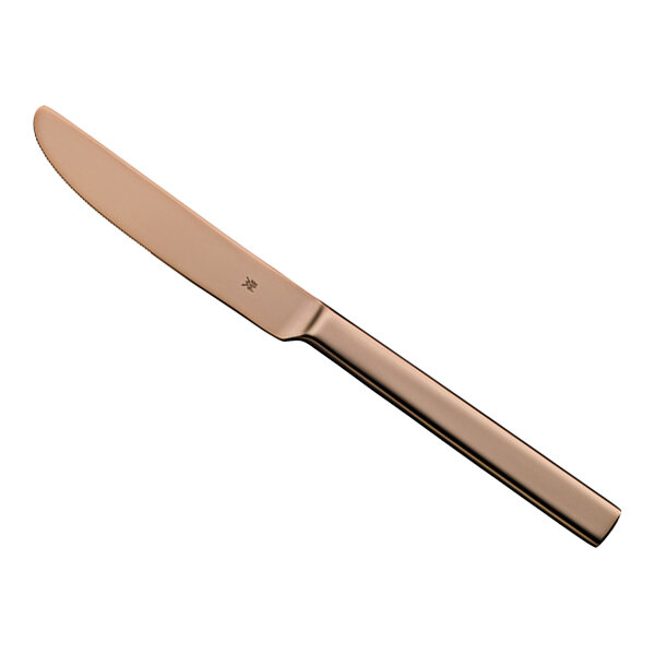 A close-up of a WMF Unic Copper stainless steel dessert knife with a rose gold handle.