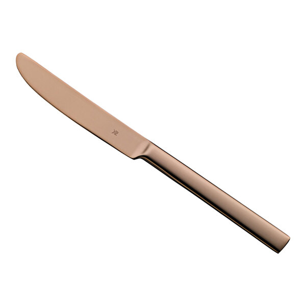 A WMF Unic Copper stainless steel table knife with a rose gold handle.