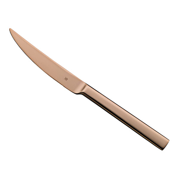 A WMF by BauscherHepp Unic stainless steel steak knife with a copper handle.