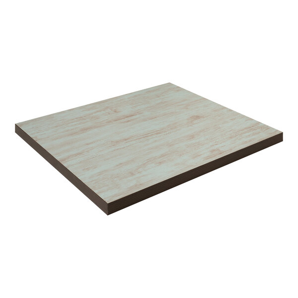 An American Tables & Seating square wooden table top with a white surface.