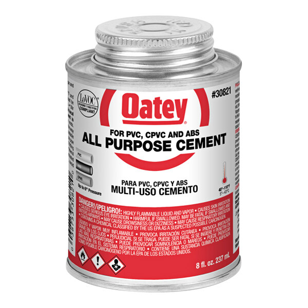 An Oatey can of clear all-purpose cement with a red label.