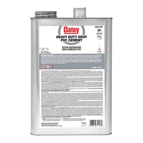 A silver Oatey PVC cement can with a white label.