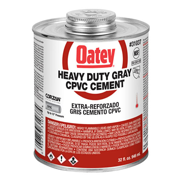 A can of Oatey heavy-duty gray CPVC cement with a red label.