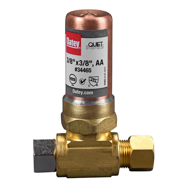 A close-up of a brass Oatey AA Tee Hammer Arrestor valve.