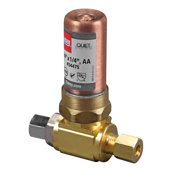 A close-up of an Oatey brass tee hammer arrestor with a copper pipe connected.