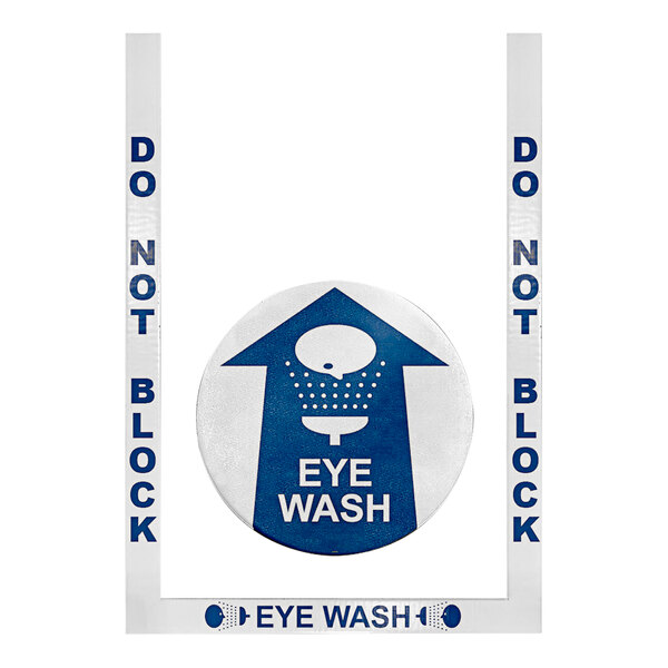 A white sign with blue text reading "Do Not Block Eye Wash" and a blue arrow pointing up.