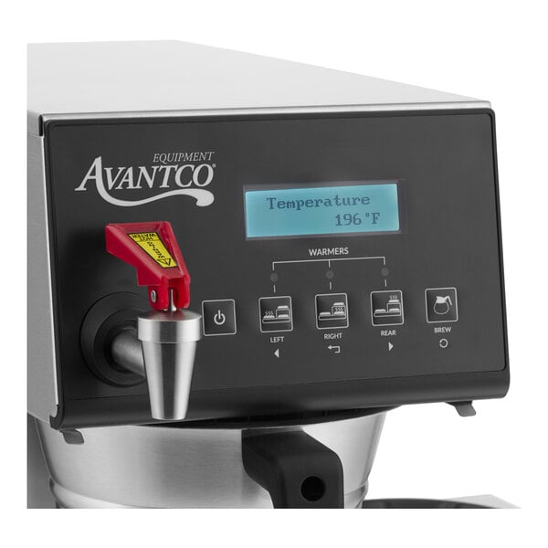 A digital automatic coffee maker with three lower decanter warmers and a display screen.