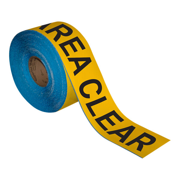 A roll of yellow and black Superior Mark safety tape with black text.