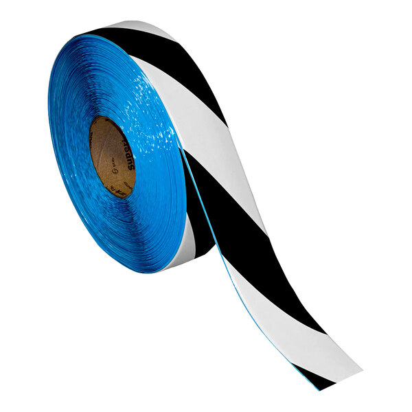 A roll of blue and black striped Superior Mark safety tape.