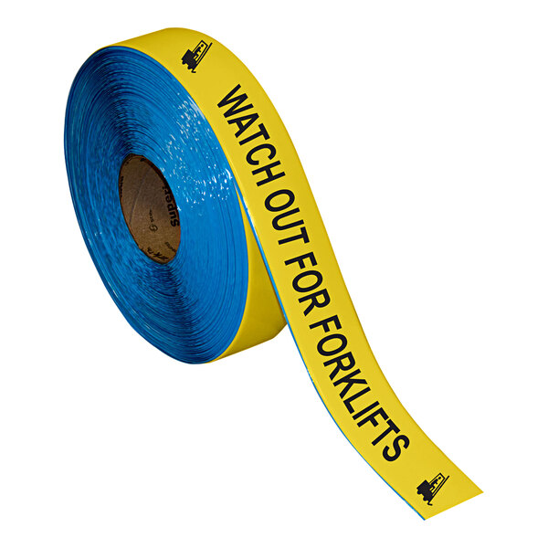 A roll of yellow and black Superior Mark safety tape with the words "Watch Out For Forklifts" in black text.