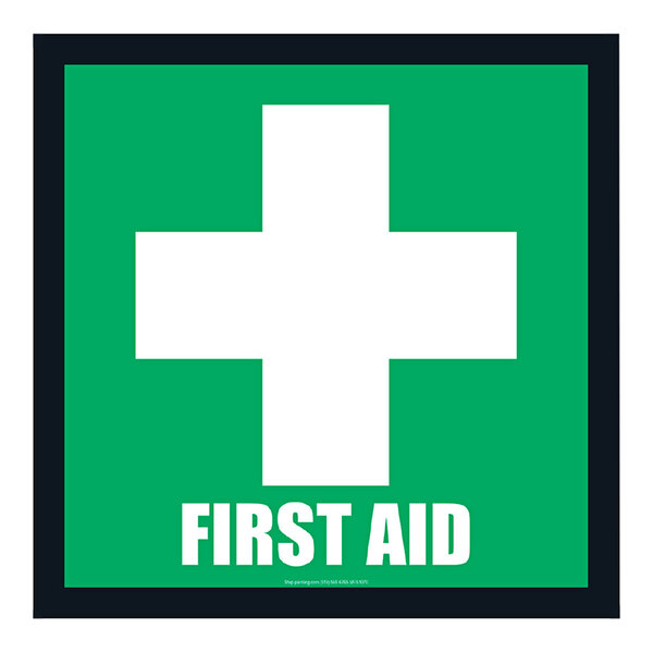 A green and white sign with the words "First Aid" and a white cross.