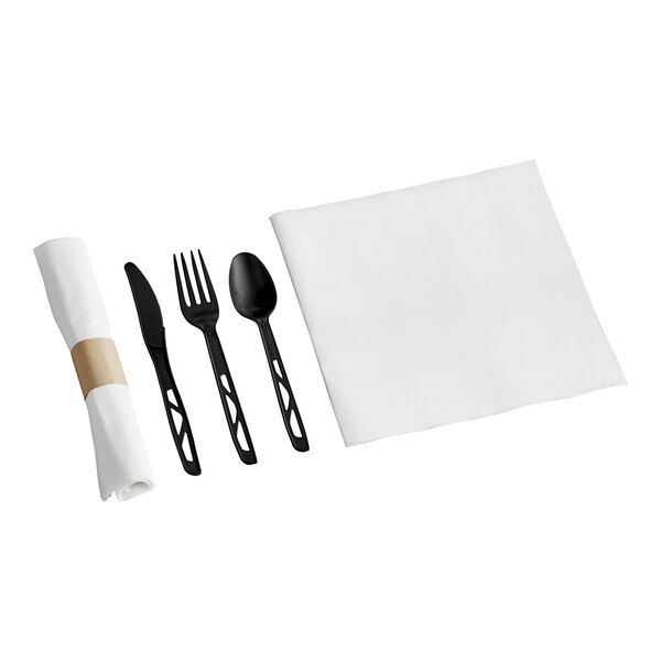 A white napkin with a pre-rolled black plastic fork, spoon, and knife.