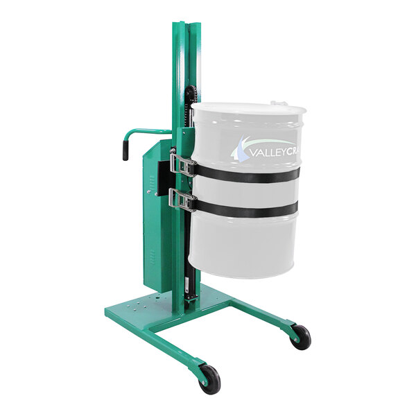 A white drum on a green Valley Craft steel straddled lift with black straps.