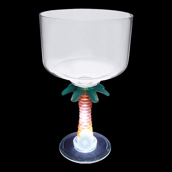 A clear plastic margarita cup with a palm tree stem and white LED light.