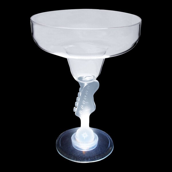 A clear plastic margarita glass with a light on the bottom.