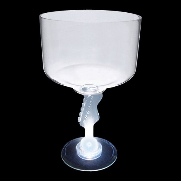 A clear plastic cup with a stem shaped like a guitar and a white LED light.