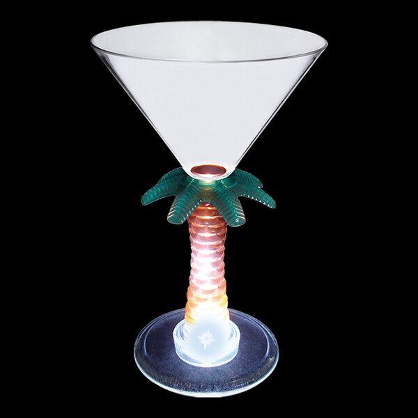 A clear plastic martini cup with a palm tree stem and a white LED light.