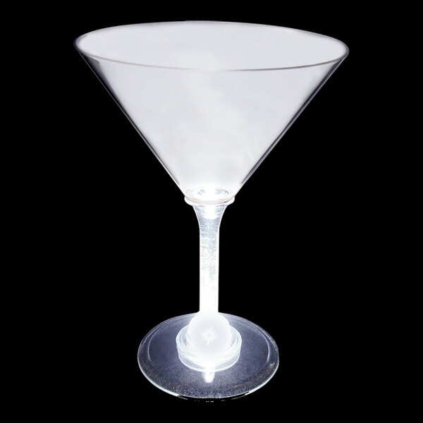 A clear plastic martini cup with a white light on it.