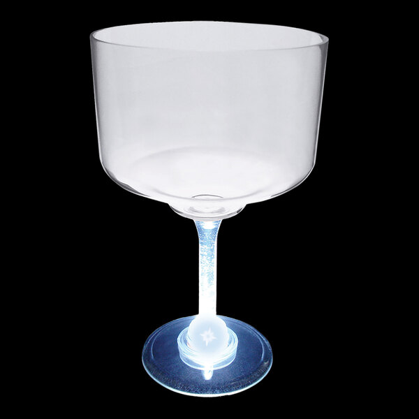 A clear plastic margarita cup with a blue LED light on the base.