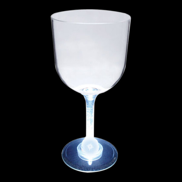A clear plastic goblet with a stem and a white LED light inside.