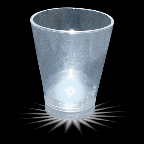 A clear plastic shot cup with a white LED light inside.