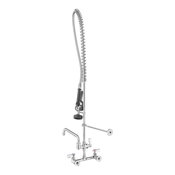 A tall, chrome wall-mounted pre-rinse faucet with a flexible spring hose, a black spray handle, and an additional side spout.