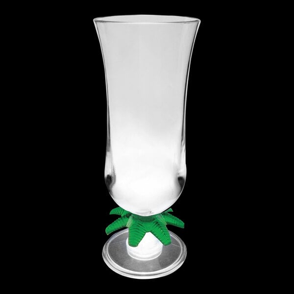 A clear plastic hurricane cup with a green palm tree and base with a white LED light inside.
