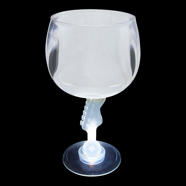 A clear plastic guitar stem goblet with a white LED light on the bottom.