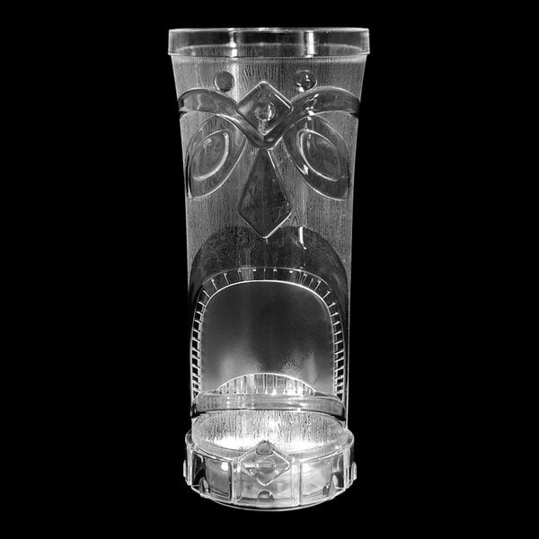 A clear plastic tiki cup with a face on it.