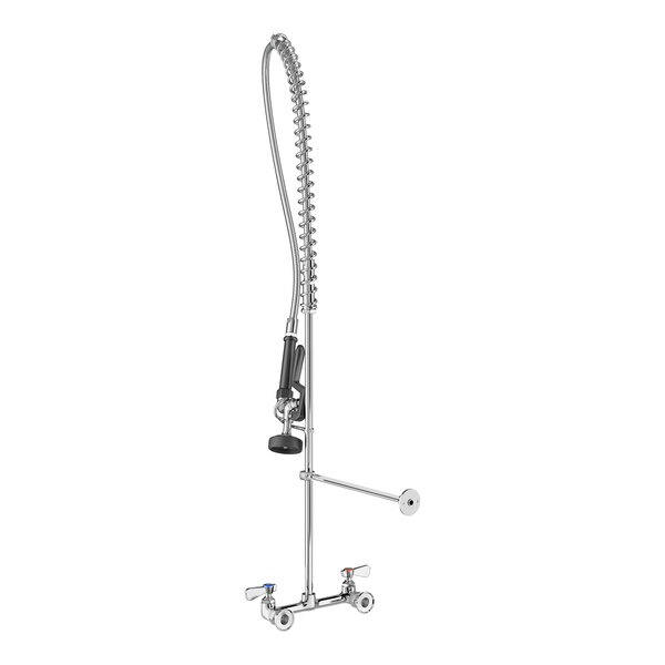 A tall, wall-mounted pre-rinse faucet with a flexible, coiled hose, spray nozzle, and dual handles for hot and cold water.