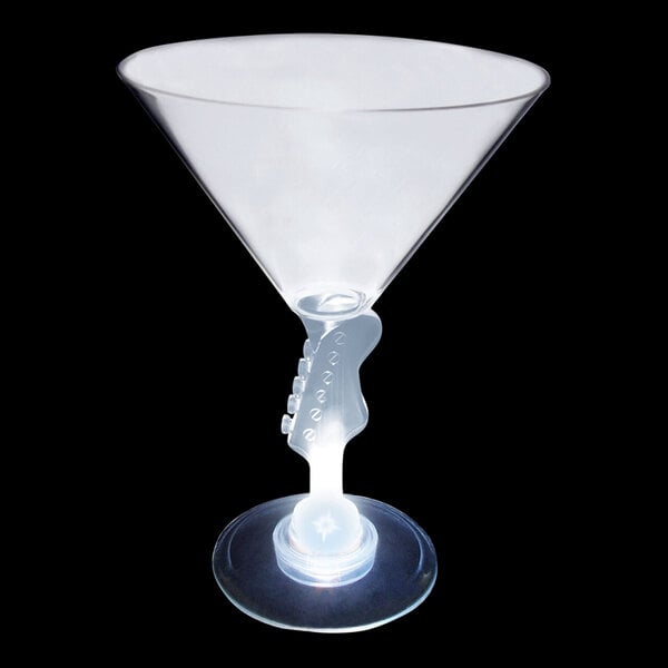 A clear plastic martini cup with a white guitar-shaped stem light.