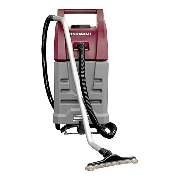 A Minuteman wet / dry vacuum with a hose and brush attached.