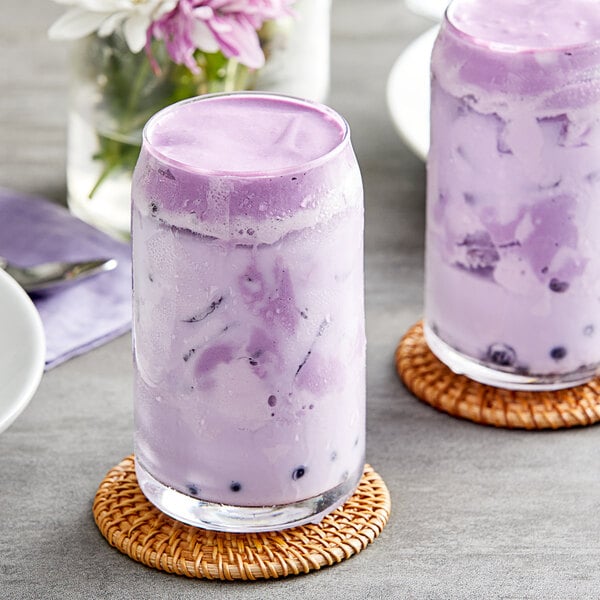 Two glasses of Fanale Taro Pudding purple drink.