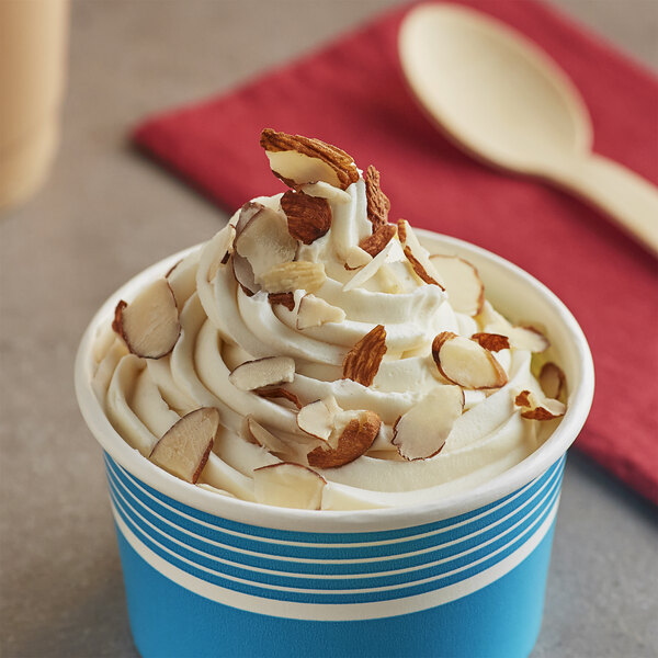 A cup of Fanale almond powder ice cream with almonds on top.