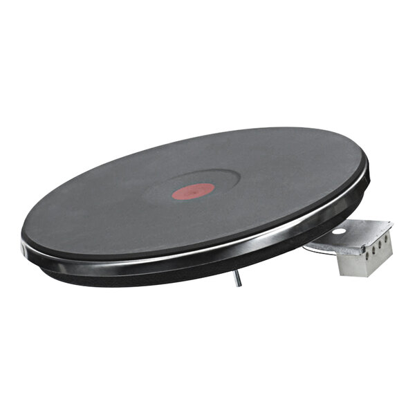 A black circular heating element with a red circle on it.