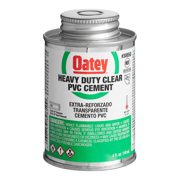 A white and green container of Oatey heavy-duty clear PVC cement with a green label.