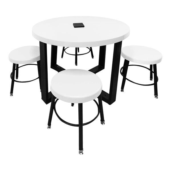 A white Sol-O-Matic children's table with four stools.
