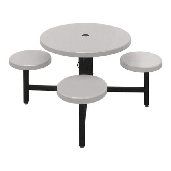 A white round Sol-O-Matic table with black seats.