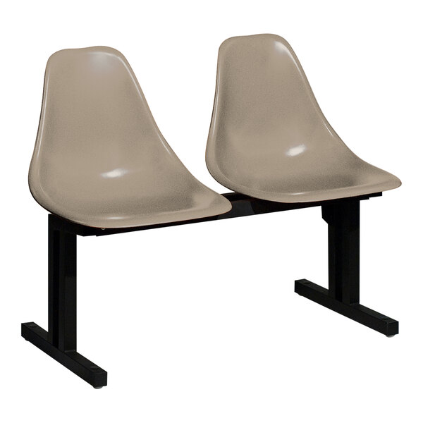 A Sol-O-Matic modular seating unit with two beige plastic chairs with black legs.