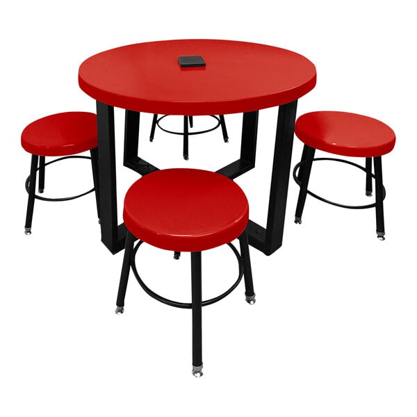 A red Sol-O-Matic children's table with four red stools.