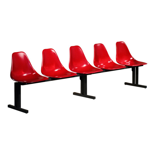 A row of four red Sol-O-Matic plastic chairs with black legs.