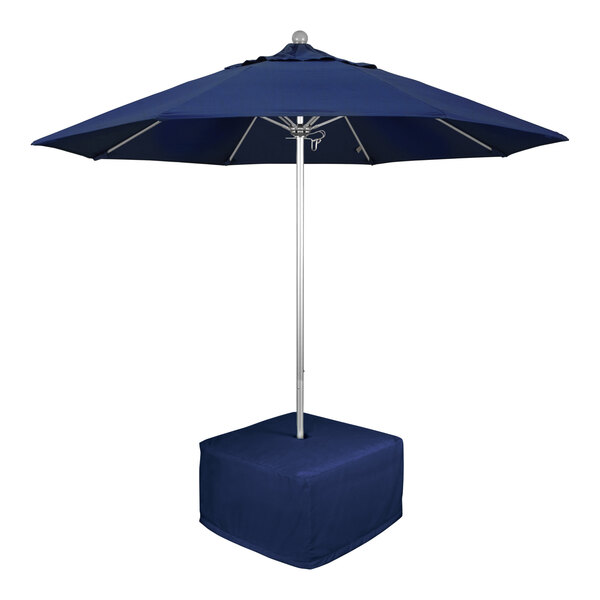 A California Umbrella blue round umbrella with a pole and metal base.