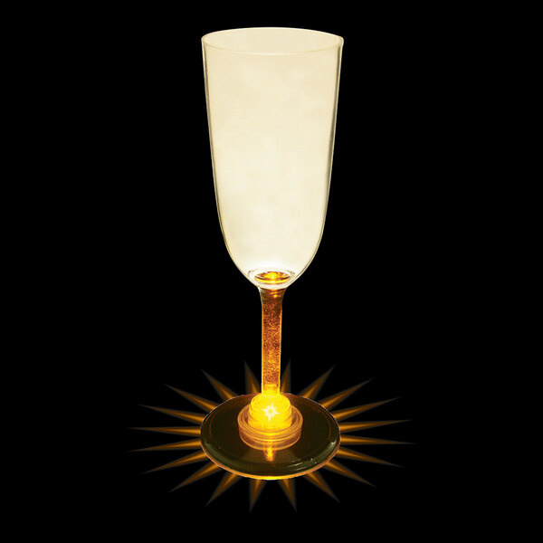 A 7 oz plastic champagne cup with a light on the bottom.