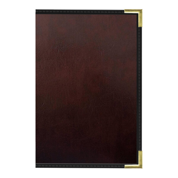 A close-up of a brown leather H. Risch wine menu cover with gold trim.