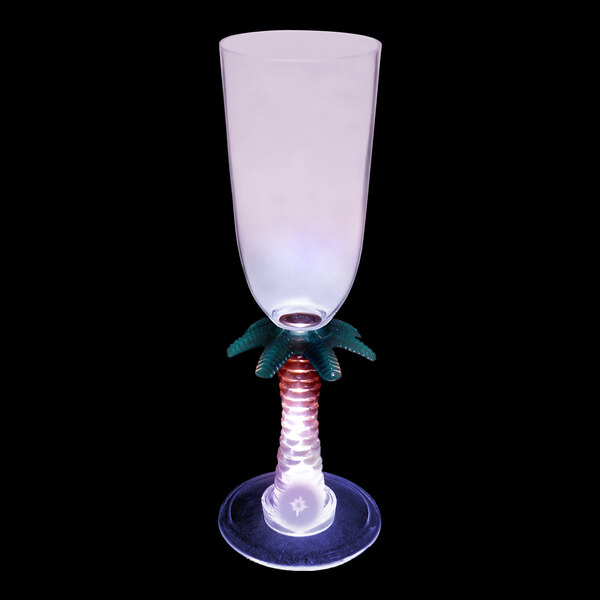 A customizable plastic champagne glass with a palm tree base and a purple LED light.