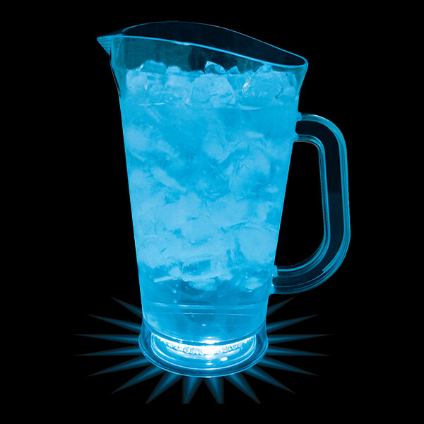 A 70 oz. customizable plastic pitcher with blue liquid and ice on a bar counter.